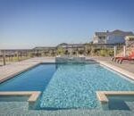 Stunning infinity pool at a seaside resort, perfect for relaxation and leisure travel.